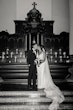 Bride wearing Hamilton wedding dress by Sottero and Midgley kissing her husband inside a church