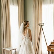 Bride wearing affordable floral ballgown wedding dress.