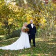 Bride with Groom at Their Outdoor Fall Wedding Wearing the Wedding Dress Called Savannah by Maggie Sottero.