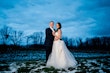 Bride Wearing Ballerina-inspired Romantic Wedding Dress Called Fairbanks By Maggie Sottero In A Snowy Field With Groom