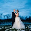 Bride Wearing Ballerina-inspired Romantic Wedding Dress Called Fairbanks By Maggie Sottero In A Snowy Field With Groom