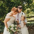 Bride Wearing Chiffon A-Line Wedding Dress Called Heather By Rebecca Ingram With The Groom And Their Daughters