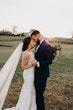 Bride and Groom Dancing Together. Bride Wearing Halter Fit And Flare Wedding Dress With Lace Motifs Called Kevyn By Sottero And Midgley