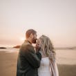 Bride wearing Summer wedding dress by Maggie Sottero kissing the groom