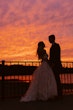 Bride wearing Laila wedding dress by Maggie Sottero standing with her husband