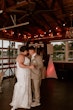 Bride wearing Tuscany Marie wedding dress by Maggie Sottero dancing with her husband