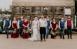 Bride Wearing Simple Fit And Flare Wedding Dress Called Josie By Rebecca Ingram With Bridal Party In Red White And Blue Attire