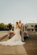 Groom With Bride Wearing Ethereal Beaded Mermaid Bridal Dress Geddes By Maggie Sottero 