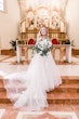 Bride wearing Hattie Lane Marie wedding dress by Rebecca Ingram