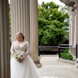 Bride Standing Outside Holding Wedding Bouquet Wearing Wedding Dress Called Mallory Dawn by Maggie Sottero