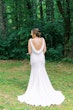 Groom with bride wearing simple crepe wedding dress Bertina by Maggie Sottero.