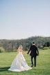 Bride wearing Selena by Maggie Sottero with her husband