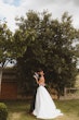 Bride wearing Derrick by Maggie Sottero kissing her husband