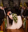 Bride wearing Lorraine Dawn wedding dress by Rebecca Ingram being dipped by her husband at the aisle