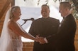 Bride Wearing Classic Elegant Wedding Dress Called Sebastiane By Maggie Sottero Smiling With Groom During Ceremony
