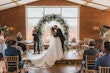 Bride wearing Derrick by Maggie Sottero kissing her husband