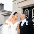 Bride wearing Ekaterina by Maggie Sottero holding hands with her husband