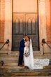 Bride wearing Hamilton wedding dress by Sottero and Midgley kissing her husband