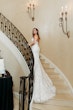 Bride Wearing Lace Mermaid Wedding Gown Called Montgomery By Sottero and Midgley Walking Up The Stairs