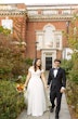 Bride Wearing Satin Aline Wedding Dress Called Ekaterina By Maggie Sottero Holding Hands With Groom