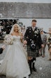 Bride Wearing Sparkly Aline Wedding Dress Called Anniston Holding Hands With Groom