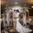 Bride Wearing Modest Lace Wedding Dress Called Tuscany Leigh By Maggie Sottero With Groom