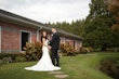 Bride wearing Mitchell Marie by Maggie Sottero with her husband