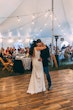 Bride Wearing Crepe Sheath Wedding Dress Called Alda By Rebecca Ingram Dancing With Groom