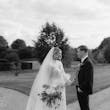 Bride wearing Yates wedding dress by Maggie Sottero with her husband