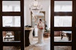 Bride Wearing Rustic Lace Wedding Dress Called Larkin Lynette By Rebecca Ingram Holding Orange and Pink Bouquet