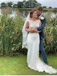 Groom hugging his bride who is wearing wedding dress called Jayleen.