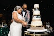 Bride Wearing Chic Crepe Wedding Gown Called Anson By Sottero And Midgley And Groom Cutting The Cake