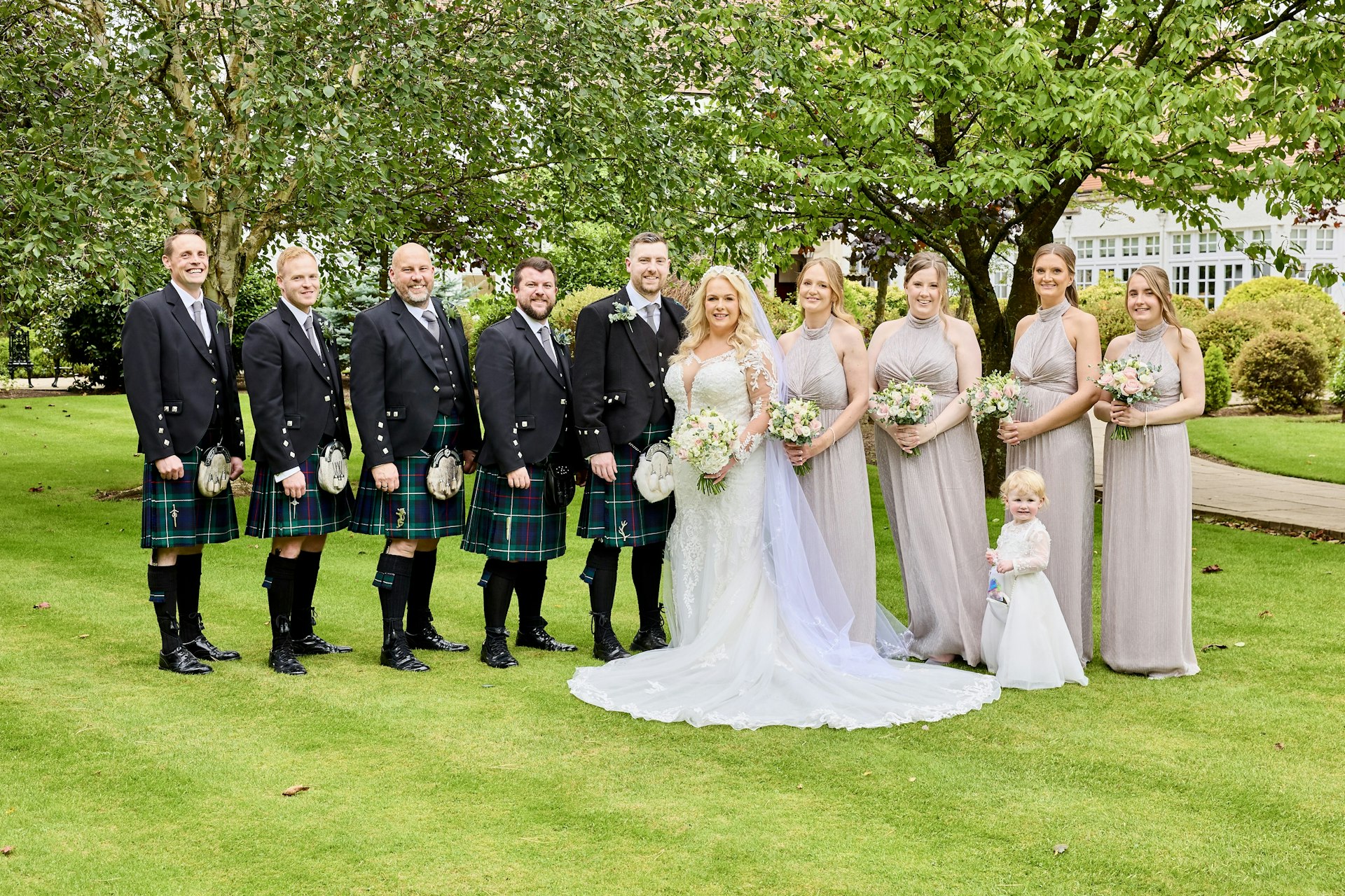 Bride wearing Saige by Maggie Sottero with her wedding party