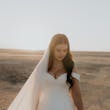 Bride Wearing Simple Ball Gown Wedding Dress With An Elegant Overskirt Called Kyrie By Maggie Sottero