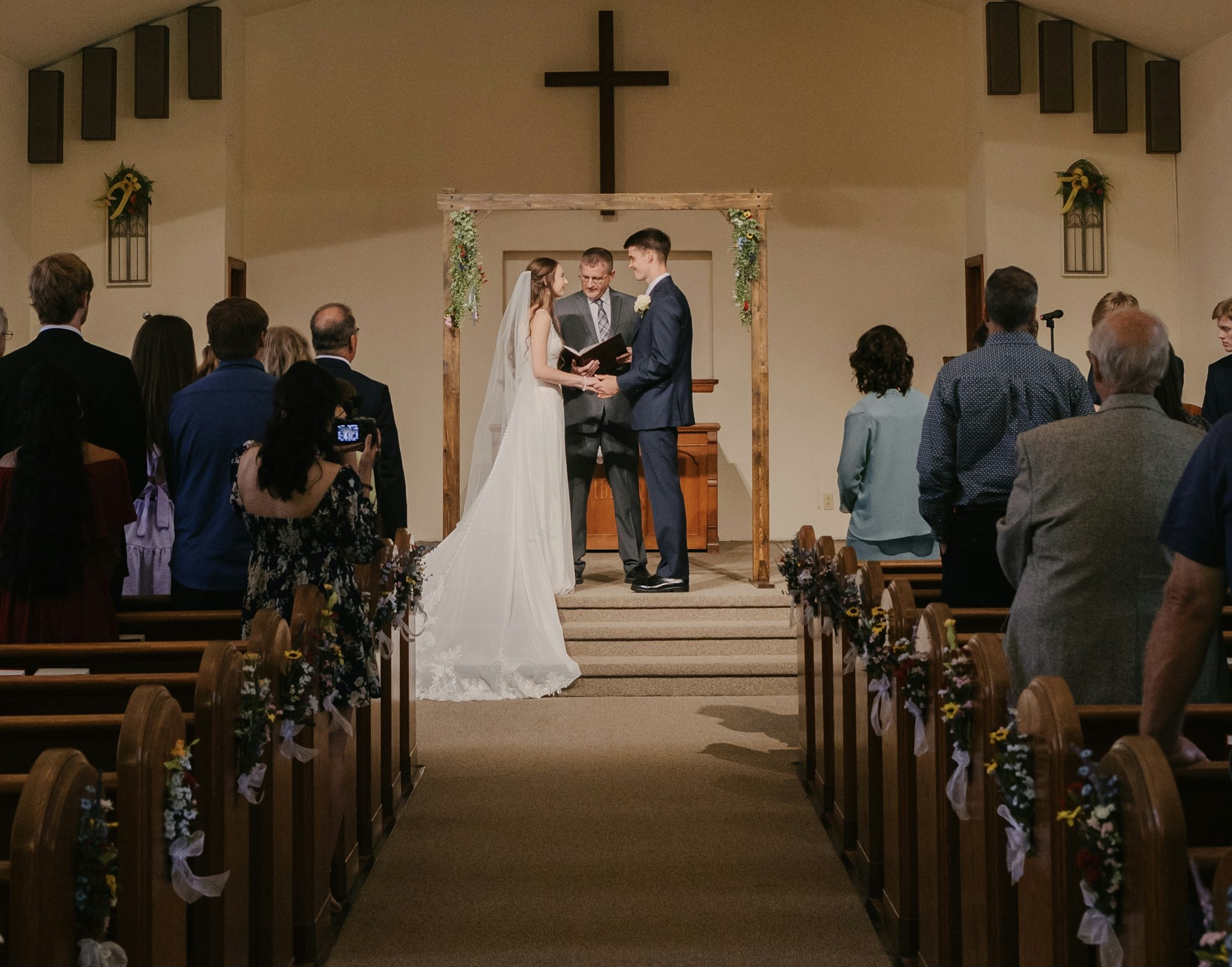 Bride wearing Charlotte by Rebecca Ingram being married to her husband