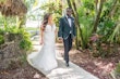 Bride wearing Hattie by Rebecca Ingram walking with her husband