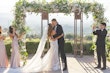 Bride Wearing Lace Fit-n-flare Wedding Dress Called Nyjah By Sottero And Midgley Kissing Groom After Ceremony