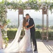 Bride Wearing Lace Fit-n-flare Wedding Dress Called Nyjah By Sottero And Midgley Kissing Groom After Ceremony