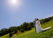 Bride Wearing Lace Long Sleeve Aline Wedding Dress Called Winter By Maggie Sottero In A Field Kissing Groom