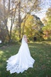 Bride Showing Savannah Wedding Dress Train by Maggie Sottero for First Look with Groom.