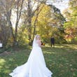 Bride Showing Savannah Wedding Dress Train by Maggie Sottero for First Look with Groom.