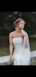 Bride Wearing Simple Fit And Flare Wedding Dress Called Francine By Rebecca Ingram With A Pearl Accented Veil