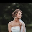 Bride Wearing Simple Fit And Flare Wedding Dress Called Francine By Rebecca Ingram With A Pearl Accented Veil