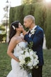 Bride wearing Hattie Lynette wedding dress by Rebecca Ingram looking at her husband