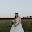 Real Bride wearing bright white modern ballgown wedding dress with ruffles called Fatima by Maggie Sottero.