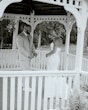 Bride wearing Damiana by Sottero and Midgley laughing with her husband at their venue