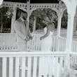 Bride wearing Damiana by Sottero and Midgley laughing with her husband at their venue