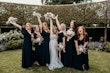 Bride wearing Stevie wedding gown by Maggie Sottero with her bridesmaids