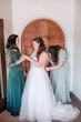 Bride Wearing A-line Tulle Wedding Dress Ardelle By Rebecca Ingram