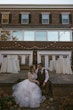 Bride With Bride Wearing Asymmetrical Wedding Gown Winona By Rebecca Ingram